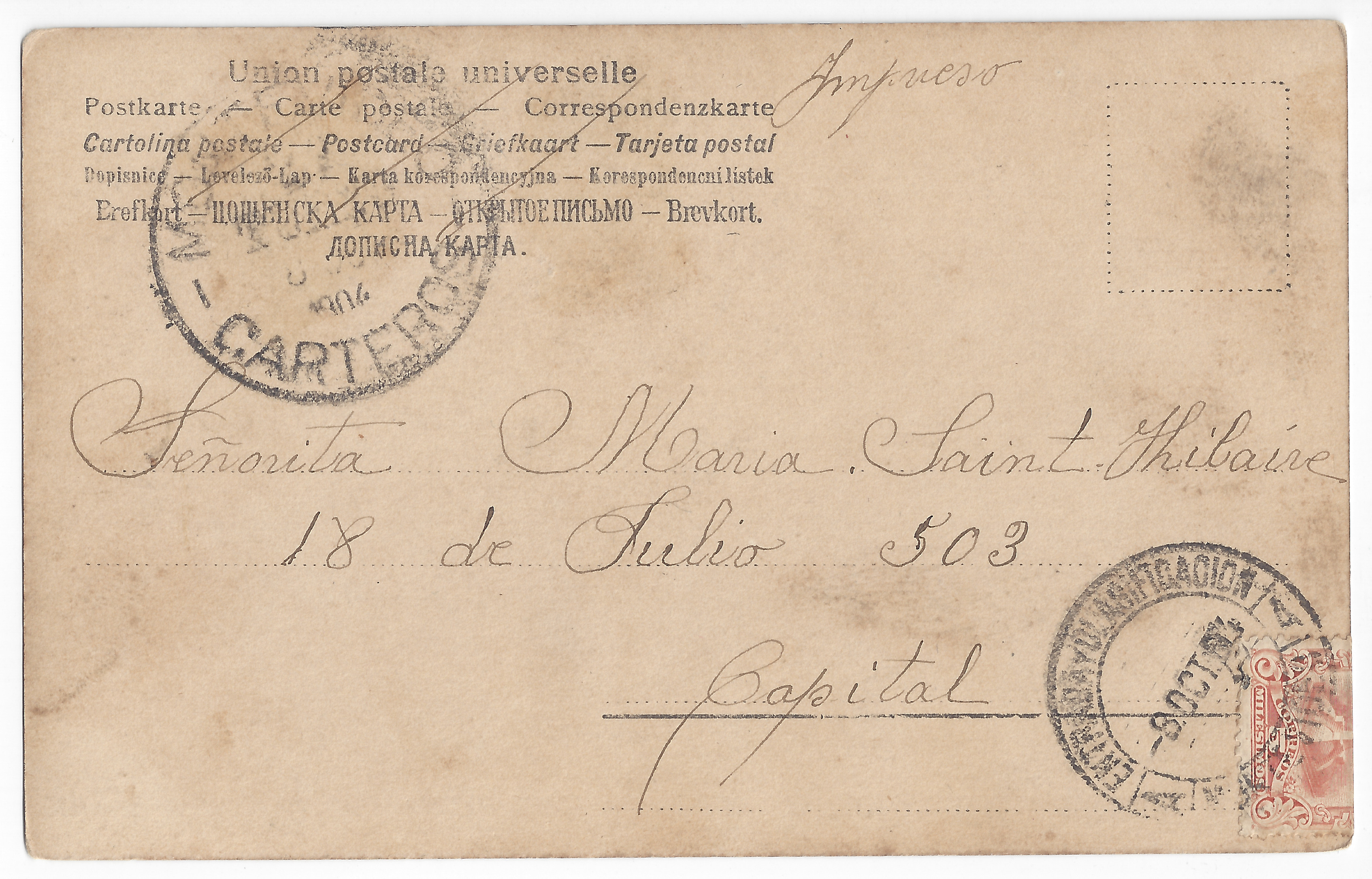 Handwritten text: recipient and address; part of a stamp.